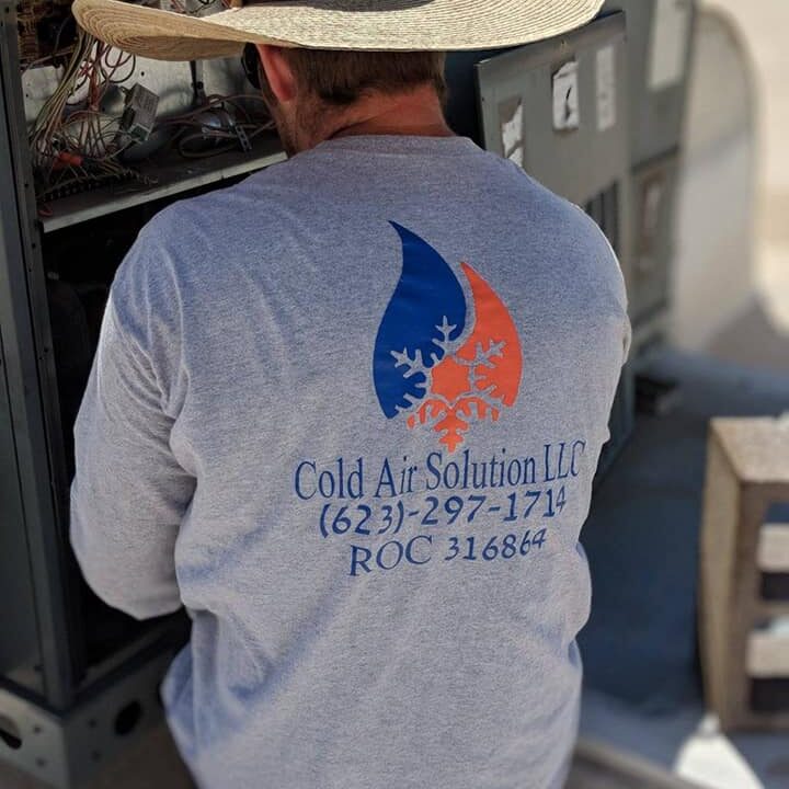 Man wearing a long-sleeve shirt with fishing and contact details on the back.
